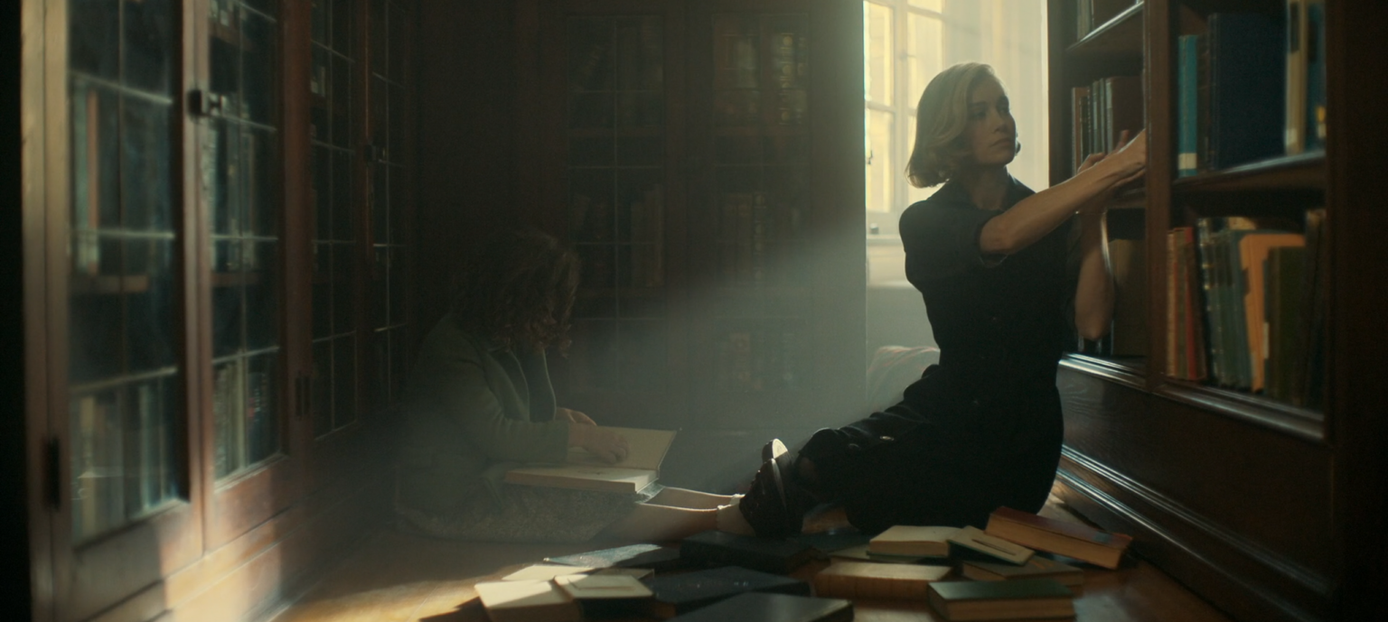 elizabeth and daughter grabbing books